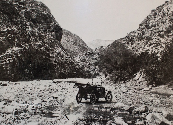 Motor Vehicle on early road through Meiringspoort – 1925